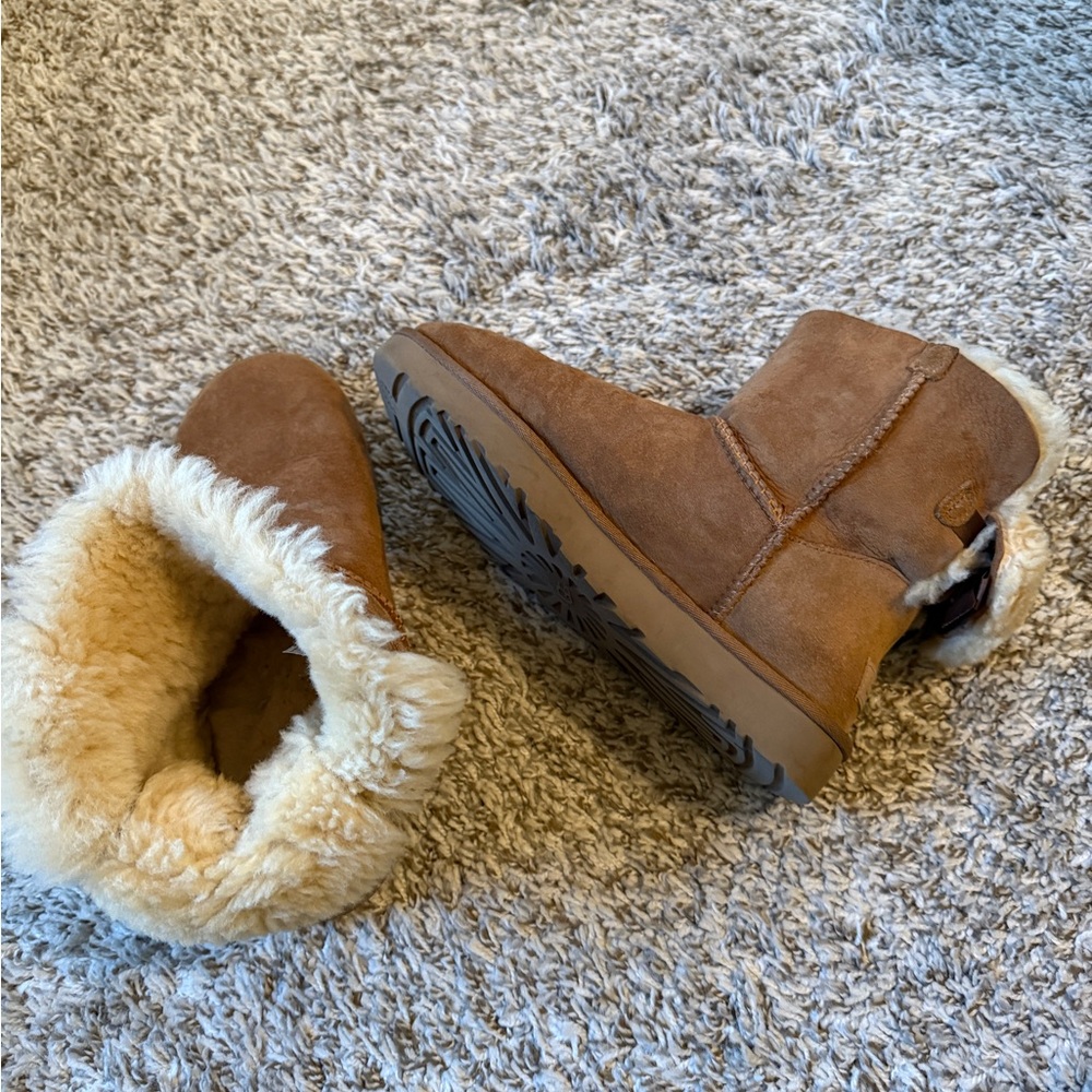 Used Uggs size 9 with ribbon on back